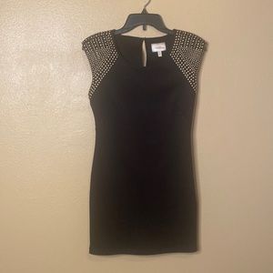 Marilyn Monroe cocktail dress. Black w/gold brads on shoulders.